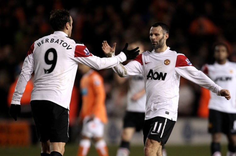 Ryan Giggs of Manchester United celebrates with team mate Dimitar Berbatov (L) at the end of the Barclays Premier League match between Blackpool an...