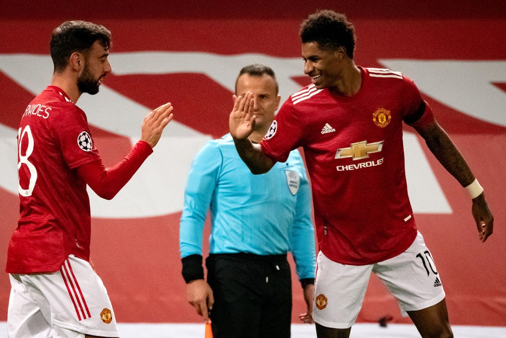 Bruno Fernandes of Manchester United celebrates scoring a goal to make the score 1-0 with Marcus Rashford (R) during the UEFA Champions League Grou...