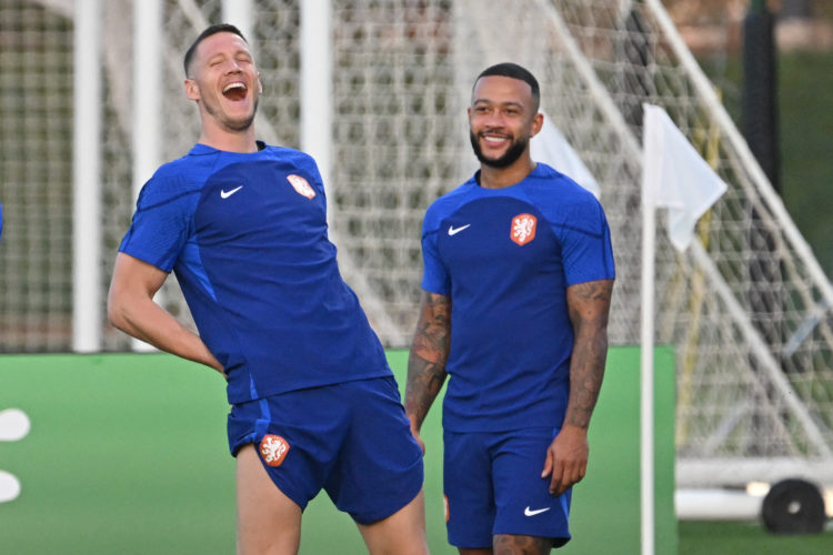 Netherlands' forward #19 Wout Weghorst (L) and Netherlands' forward #10 Memphis Depay take part in a training session at Qatar University training ...