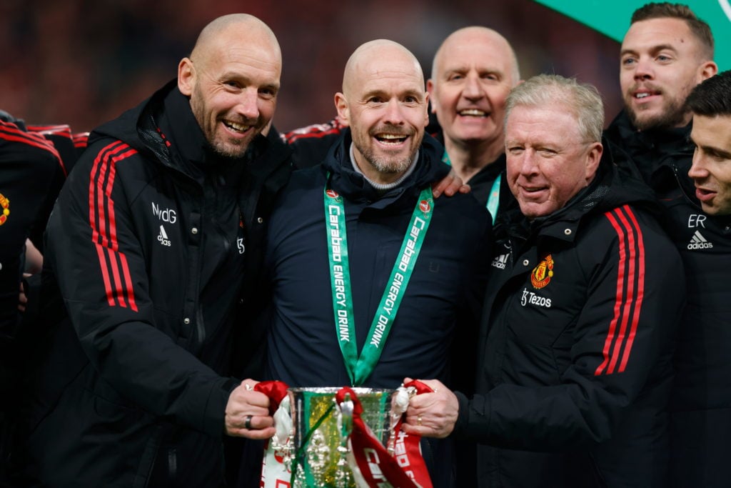 Erik ten Hag the manager / head coach of Manchester United and his coaching staff with the Carabao Cup trophy after the Carabao Cup Final match bet...