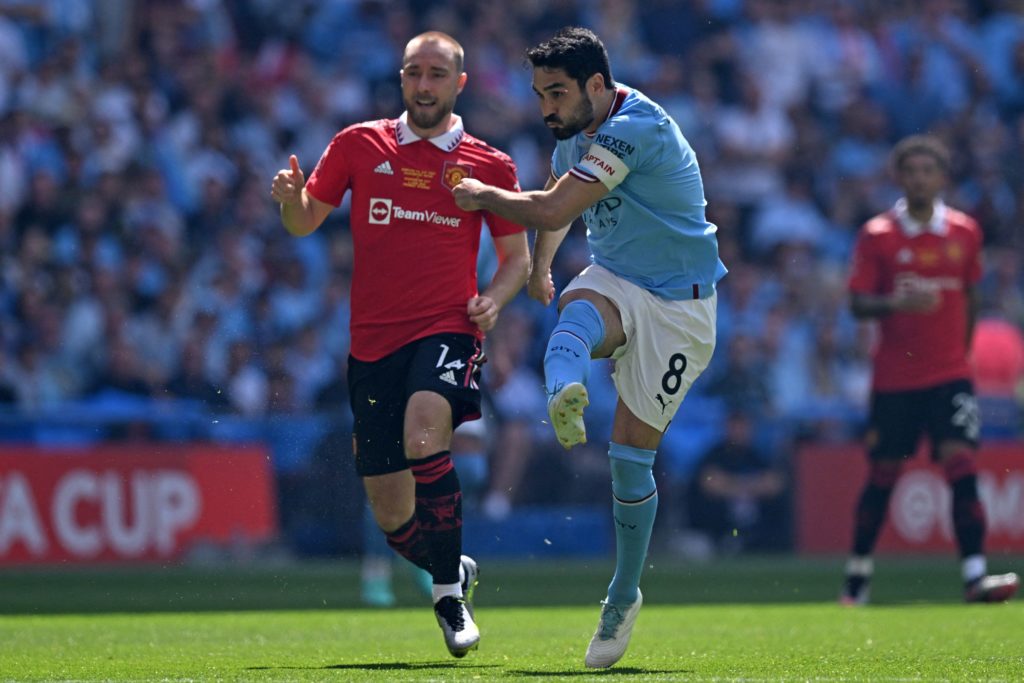 Manchester City's German midfielder Ilkay Gundogan shoots to score the early opening goal during the English FA Cup final football match between Ma...