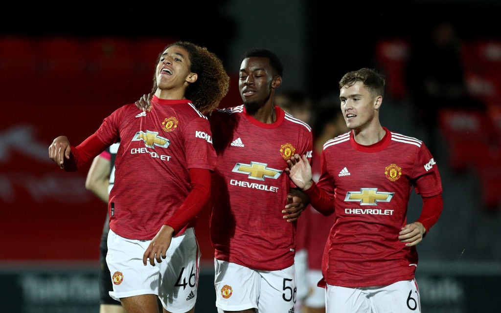 Hannibal Mejbri of Manchester United U21 celebrates scoring the opening goal with team mates during the EFL Trophy match between Salford and Manche...