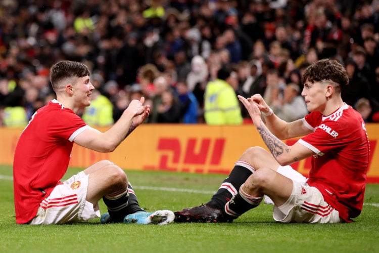 Alejandro Garnacho of Manchester United celebrates with team mate Charlie McNeill of Manchester United after scoring their sides second goal during...