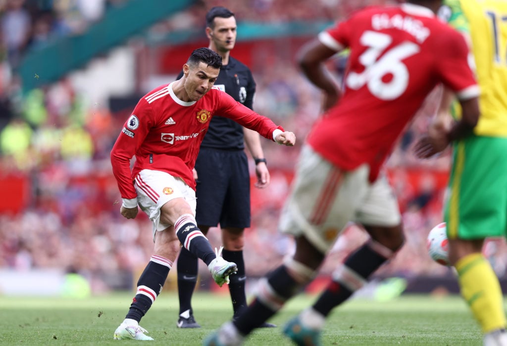 Cristiano Ronaldo of Manchester United scores their sides third goal and their hat-trick during the Premier League match between Manchester United ...