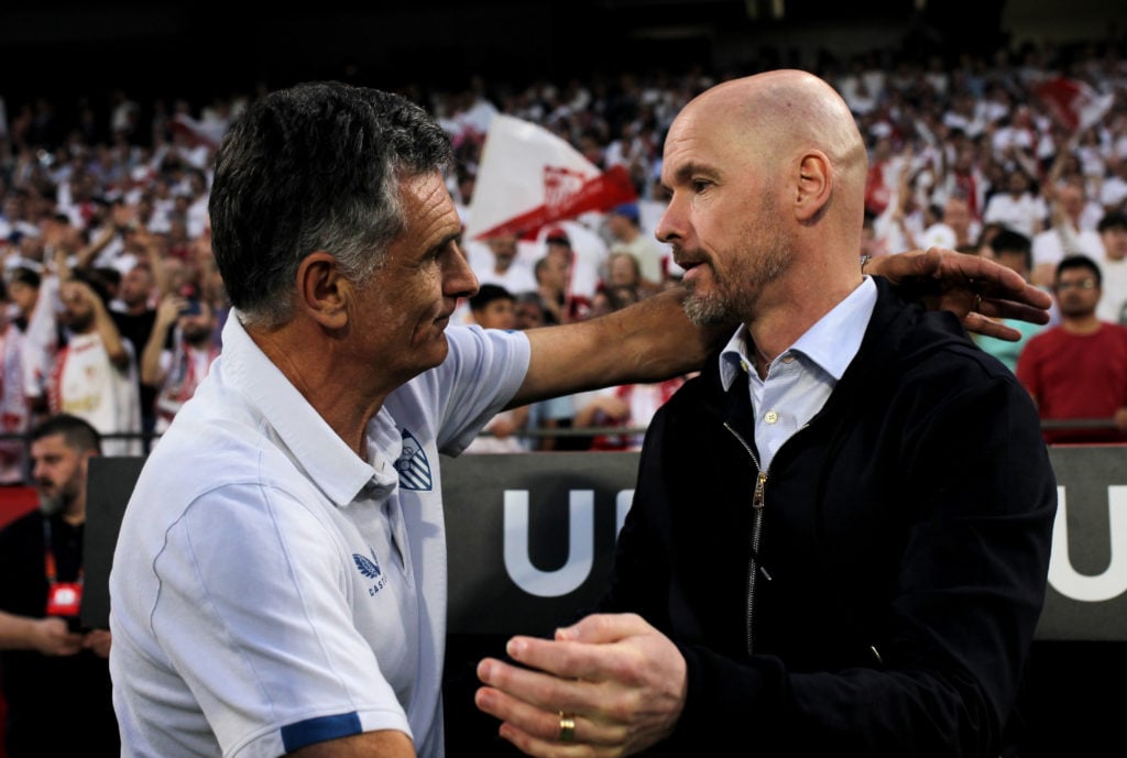 Jose Luis Mendilibar, Manager of Sevilla FC, shakes hands with Erik ten Hag, Manager of Manchester United, prior to the UEFA Europa League Quarterf...