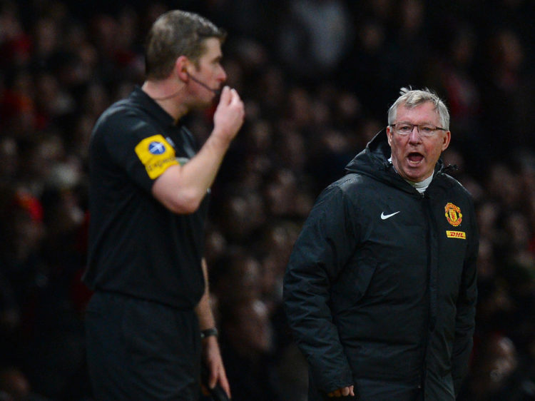 Manchester United's Scottish manager Alex Ferguson (R) shouts at assistant referee Jake Collin (L) during the English Premier League football match...