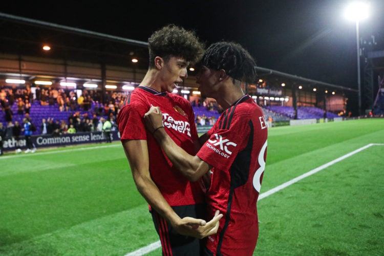 Ethan Wheatley of Manchester United celebrates with teammate Ethan Williams after the winning penalty after the EFL Papa John's Trophy group stage ...