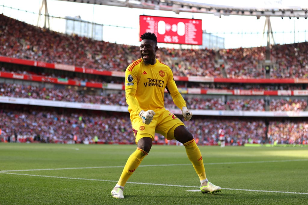 Andre Onana of Manchester United celebrates his side's first goal scored by Marcus Rashford of Manchester United during the Premier League match be...