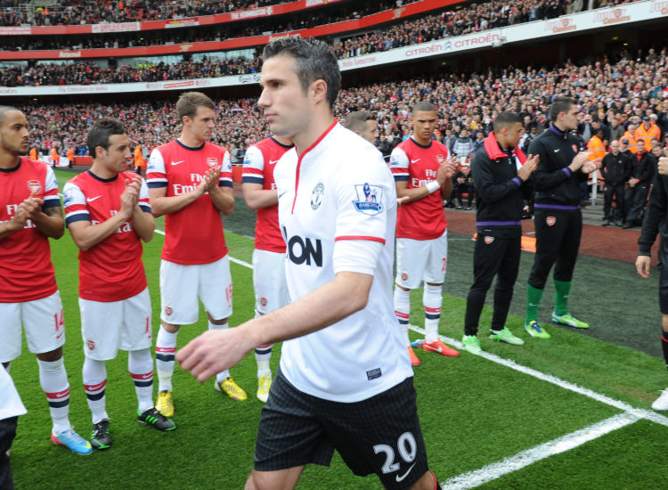 Manchester United's Robin van Persie walks through Arsenal's Guard Of Honour before the Barclays Premier League match between Arsenal and Mancheste...