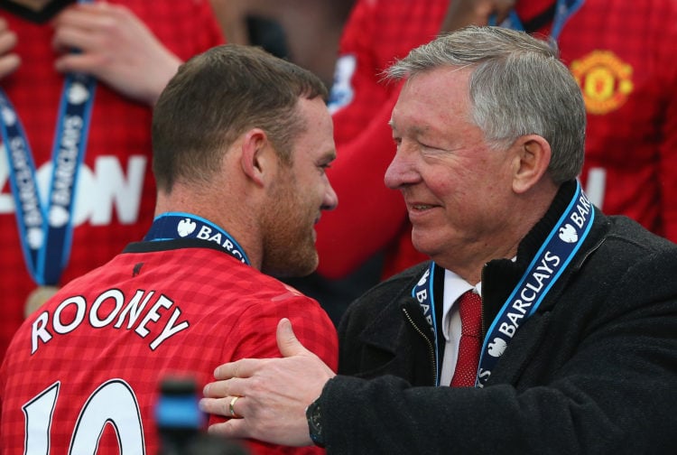 Manchester United Manager Sir Alex Ferguson congratulates Wayne Rooney following the Barclays Premier League match between Manchester United and Sw...