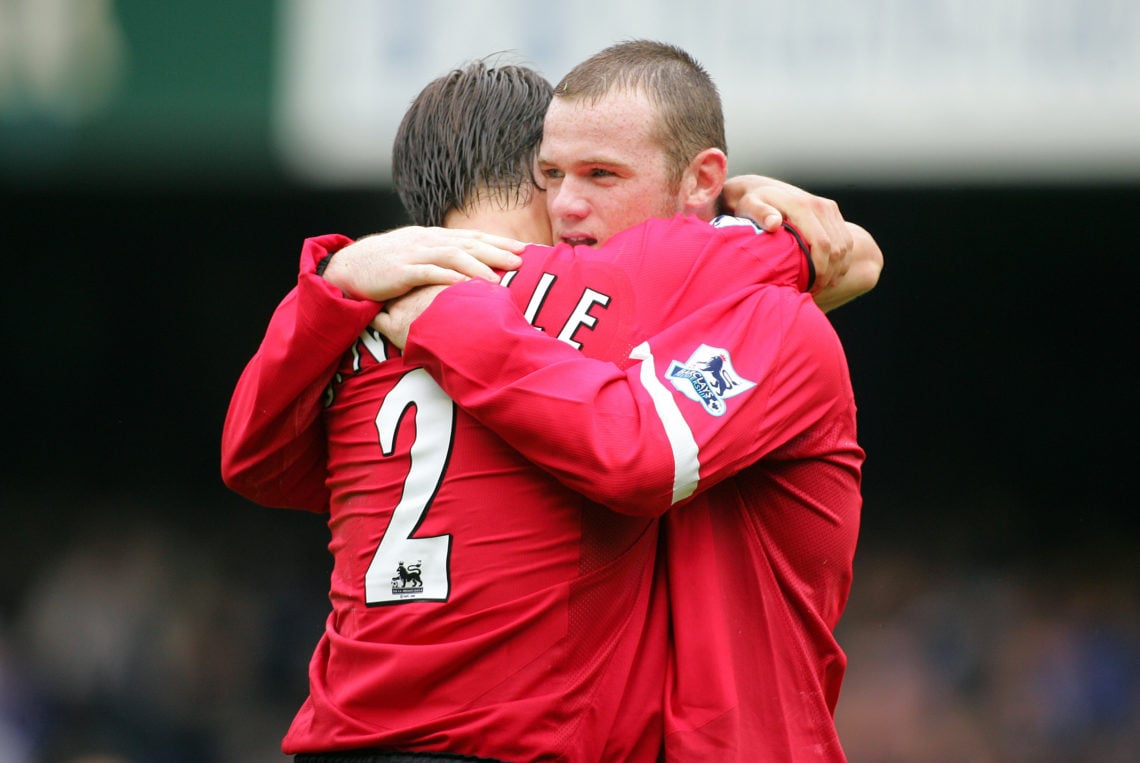 Wayne Rooney & Gary Neville celebrate during the Premier League match between Everton and Manchester United at the Goodison Park on August 13, ...