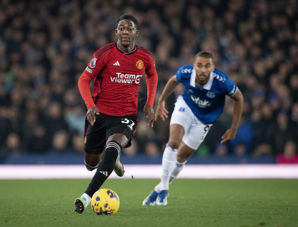 Kobbie Mainoo of Manchester United and Dominic Calvert-Lewin of Everton in action during the Premier League match between Everton FC and Manchester...