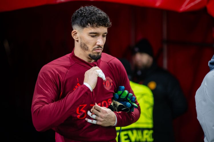 Altay Bayindir of Manchester United warms up ahead of the UEFA Champions League match between Manchester United and FC Bayern München at Old Traffo...