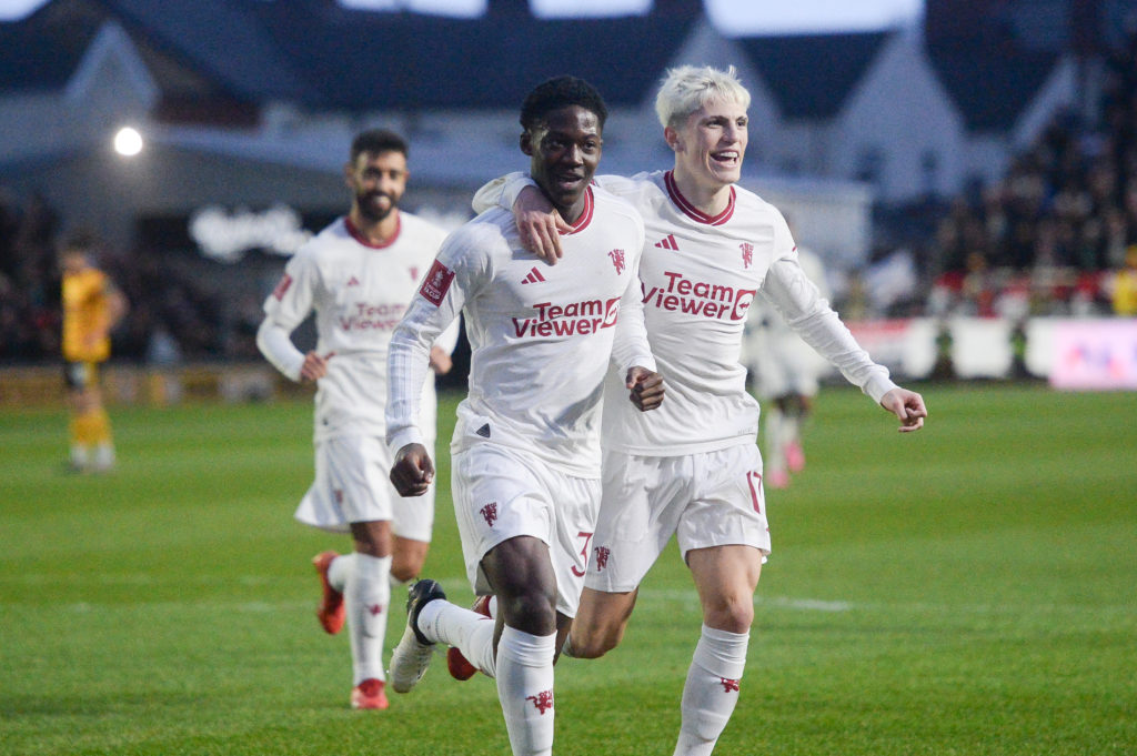 Manchester United's Kobbie Mainoo  celebrates scoring his side's second goal   during the Emirates FA Cup Fourth Round match between Newport County...