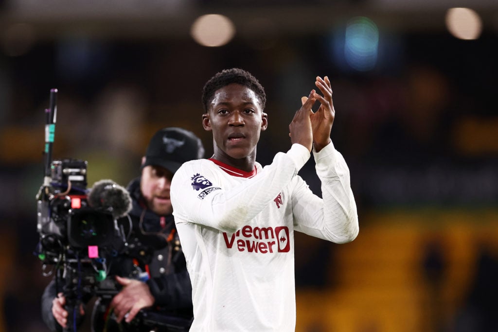 Kobbie Mainoo of Manchester United applauds the fans at full-time following the teams victory in the Premier League match between Wolverhampton Wan...