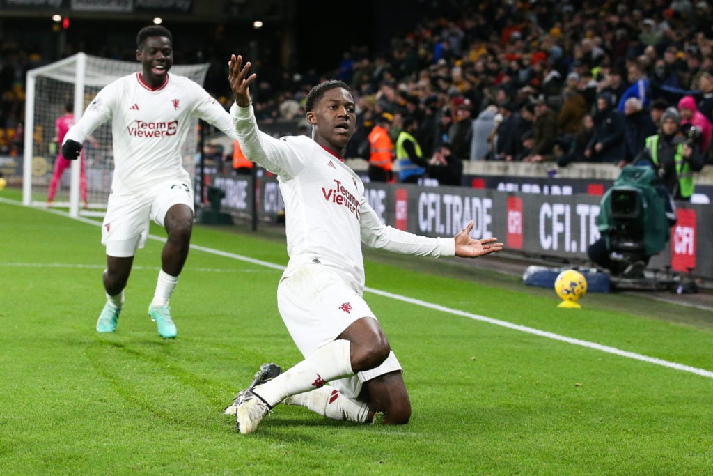 Kobbie Mainoo of Manchester United celebrates after scoring his side's fourth and winning goal during the Premier League match between Wolverhampto...