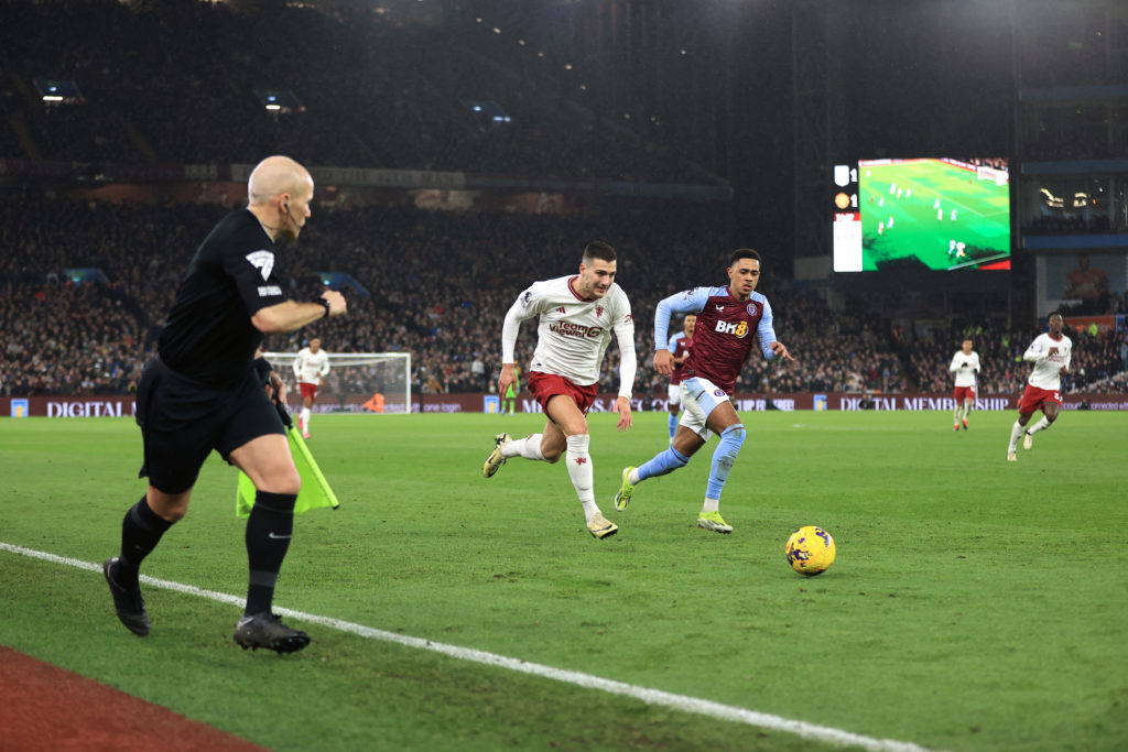 Diogo Dalot of Manchester United battles with Jacob Ramsey of Aston Villa during the Premier League match between Aston Villa and Manchester United...