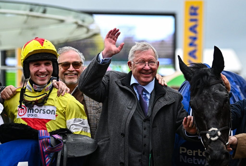 Gloucestershire , United Kingdom - 14 March 2024; Jockey Harry Cobden and owner Sir Alex Ferguson celebrate with Monmiral after victory in the Pert...