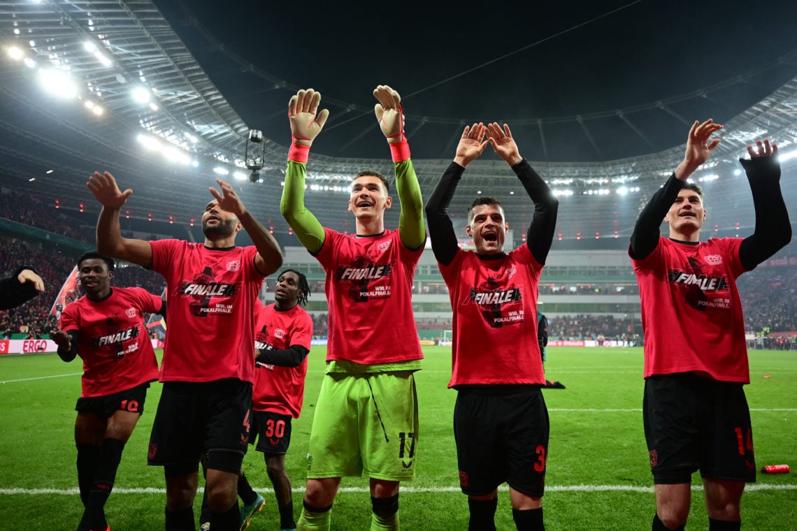 TOPSHOT - (LtoR) Bayer Leverkusen's Nigerian midfielder #19 Nathan Tella, Bayer Leverkusen's German defender #04 Jonathan Tah, Bayer Leverkusen's D...