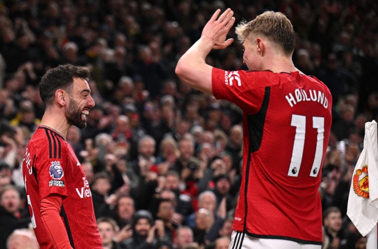 Manchester United's Portuguese midfielder #08 Bruno Fernandes (L) celebrates scoring the team's third goal with Manchester United's Danish striker ...