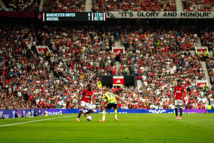 Aaron Wan-Bissaka of Manchester United in action with Leandro Trossard of Arsenal FC during the Premier League match between Manchester United and ...