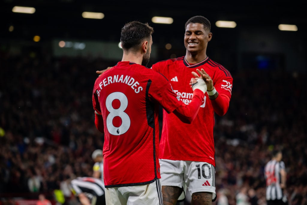 Bruno Fernandes and Marcus Rashford of Manchester United celebrate Rasmus Hojlund's third goal during the Premier League match between Manchester U...