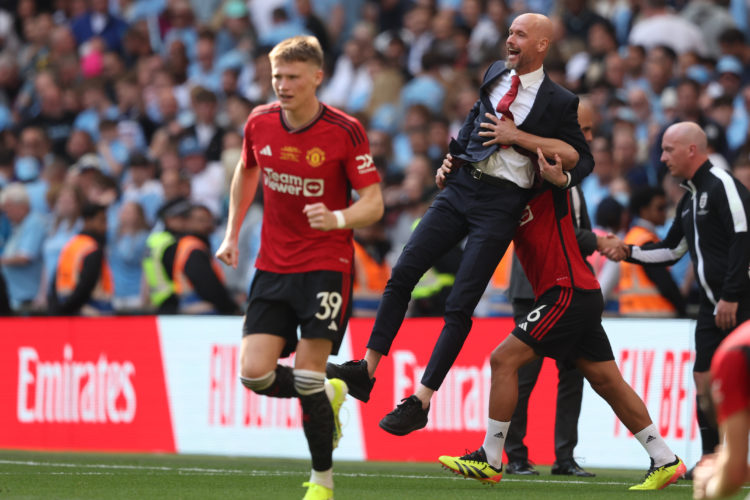 Erik ten Hag, Manager of Manchester United celebrates as he is lifted in the air by Lisandro Martinez of Manchester United during the Emirates FA C...