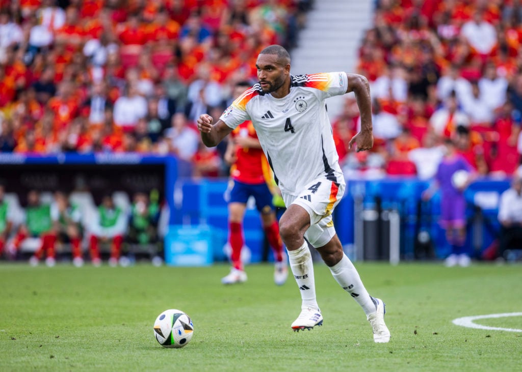 Jonathan Tah of Germany runs with the ball during the UEFA EURO 2024 quarter-final match between Spain and Germany at Stuttgart Arena on July 5, 20...