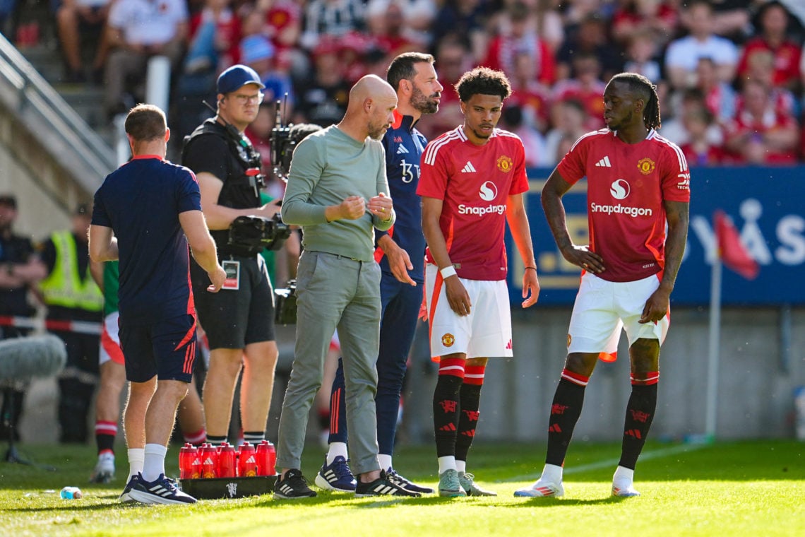 Manchester United's Dutch manager Erik ten Hag (L) speaks with his players during the friendly football match between Rosenborg BK and Manchester U...