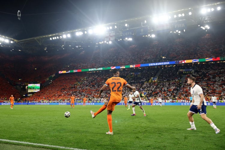 General view as Denzel Dumfries of Netherlands passes the ball during the UEFA EURO 2024 semi-final match between Netherlands and England at Footba...