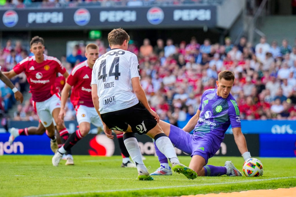 Manchester United's Czech goalkeeper Radek Vitek (R) saves the ball during the friendly football match between Rosenborg BK and Manchester United a...