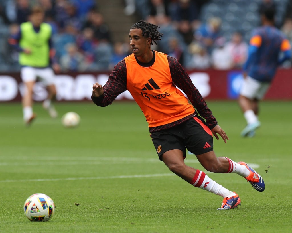 Leny Yoro of Manchester United warms up ahead of the pre-season friendly match between Manchester United and Glasgow Rangers at Murrayfield Stadium...