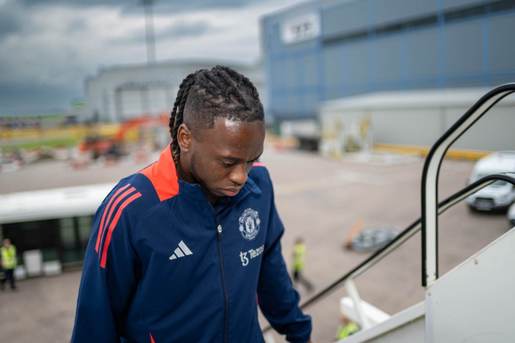 Aaron Wan-Bissaka of Manchester United departs from Manchester Airport ahead of their pre-season tour on July 24, 2024 in Manchester, England.