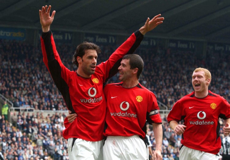 Ruud van Nistelrooy celebrates scoring from the penalty spot with teammates Roy Keane and Paul Scholes during the FA Barclaycard Premiership match ...