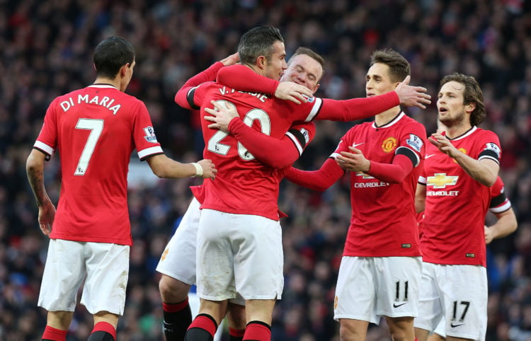 Robin van Persie of Manchester United celebrates scoring their first goalduring the Barclays Premier League match between Manchester United and Lei...