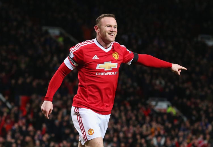 Wayne Rooney of Manchester United celebrates scoring his team's third goal during the Barclays Premier League match between Manchester United and S...