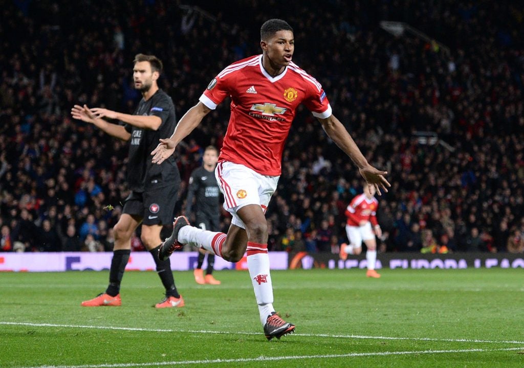 Manchester United's English striker Marcus Rashford celebrates scoring his team's second goal during the UEFA Europa League round of 32, second leg...