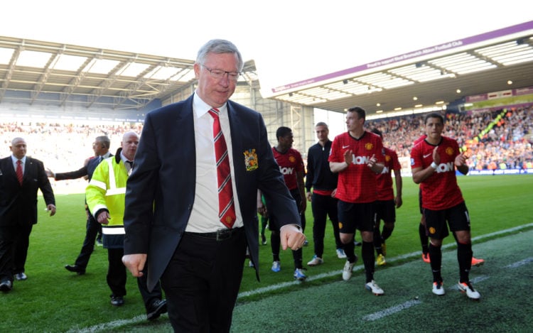 Sir Alex Ferguson the head coach / manager of Manchester United is applauded by his own players as he walks back to the dressing room after his 150...