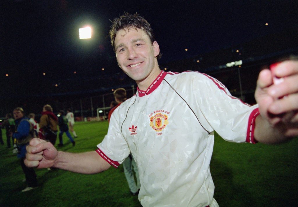 Manchester United captain Bryan Robson celebrates after the 1991 UEFA European Cup Winners Cup Final between Manchester United and Barcelona on May...