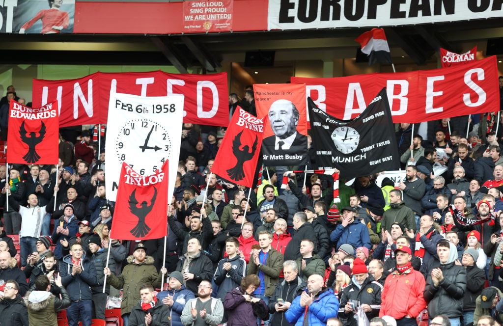 Fans pay tribute to the Manchester United team that were involved in the Munich disaster, prior to the Premier League match between Manchester Unit...