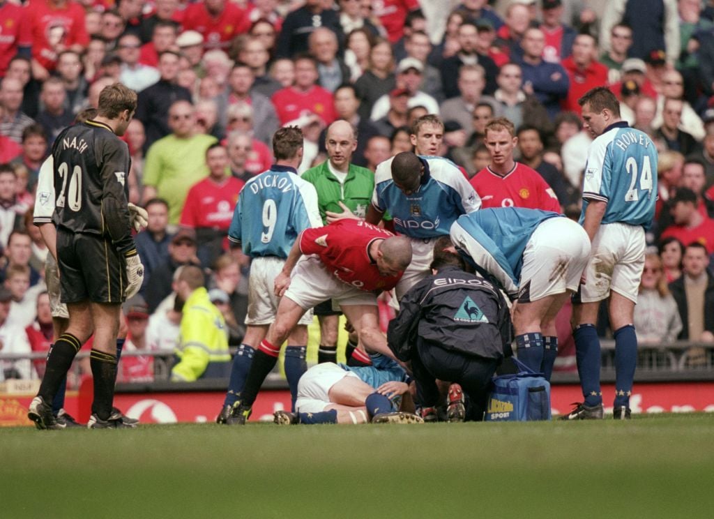 Roy Keane of Manchester United shouts at Alf Inge Haaland of Manchester City following his red card during the FA Carling Premiership match played ...