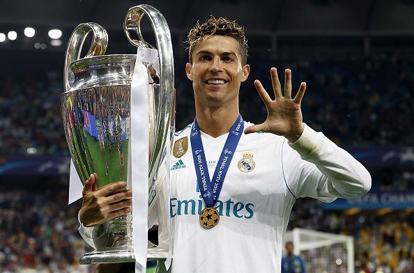 Cristiano Ronaldo of Real Madrid celebrates with The UEFA Champions League trophy following his sides victory in the UEFA Champions League Final be...