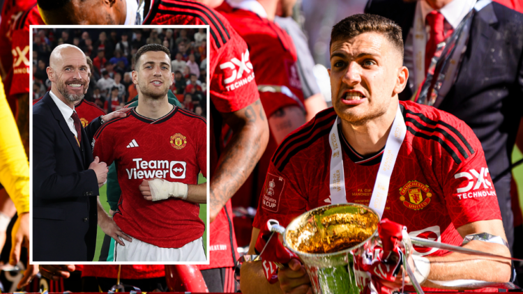 Diogo Dalot of Manchester United raises the winners’ trophy while celebrates with his team and fans after winning Manchester City during the Emirat...